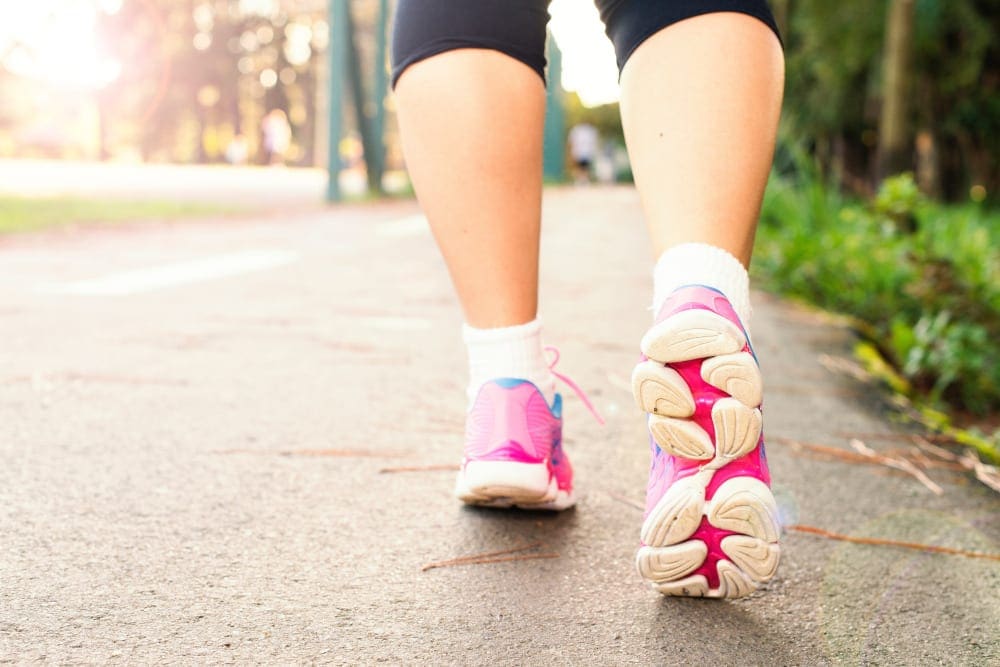 Close up of women's legs walking in the park.