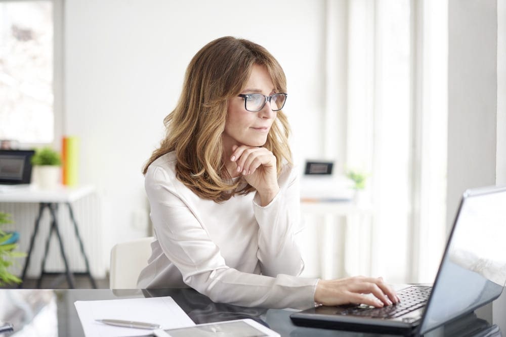 Shot of an attractive mature businesswoman working on laptop in her workstation.