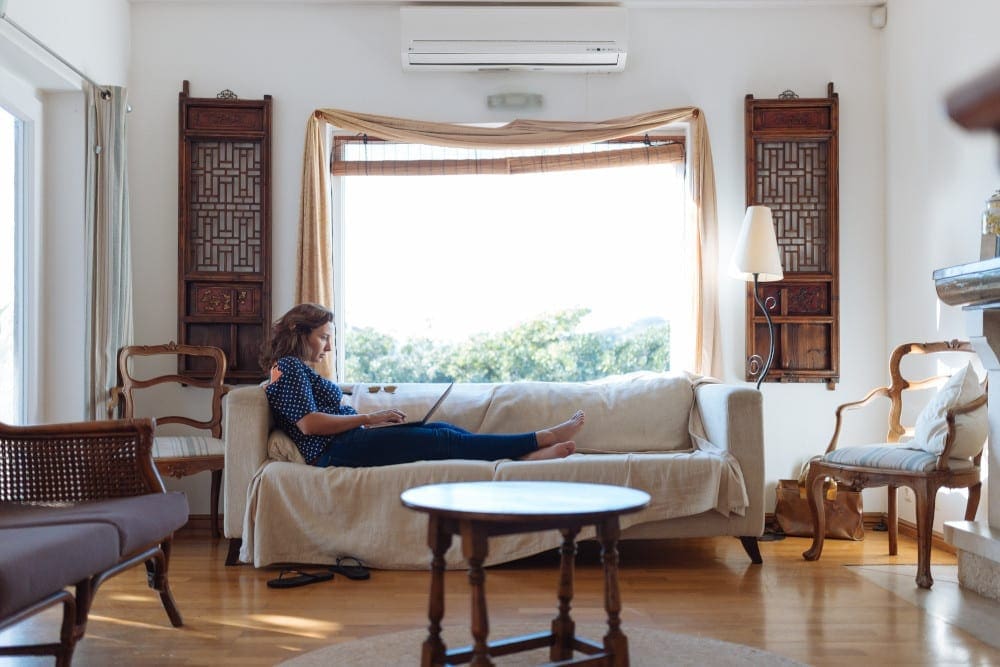 Woman relaxing on a sofa in the living room.