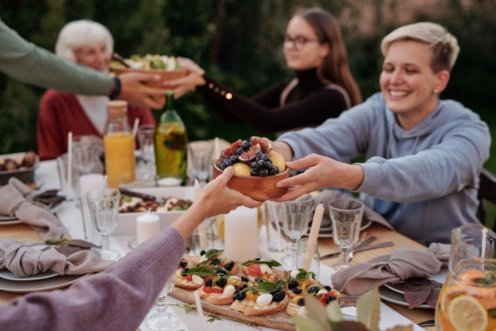 family at dinner table outside