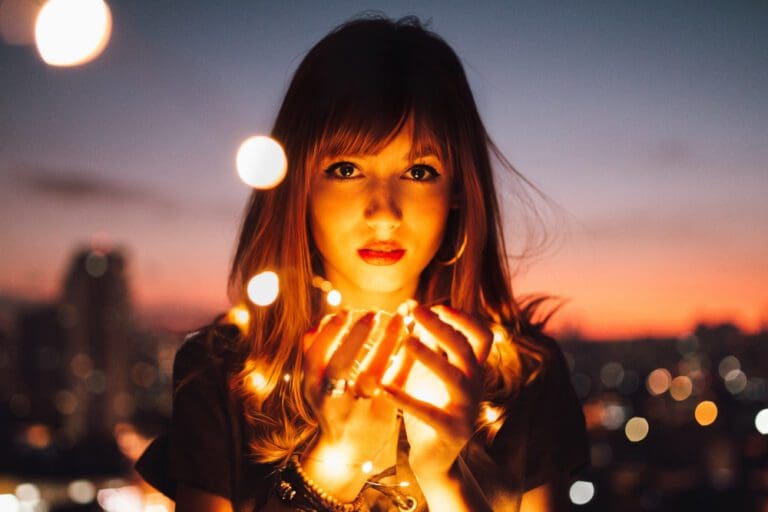 woman holding glowing light