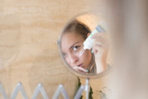 woman applying face cream