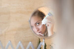 woman applying face cream